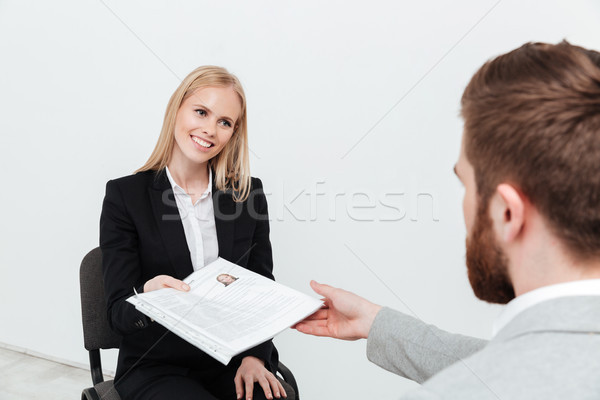 Mosolyog hölgy ül iroda főnök tart Stock fotó © deandrobot