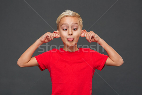Grappig weinig jongen kind tonen tong Stockfoto © deandrobot