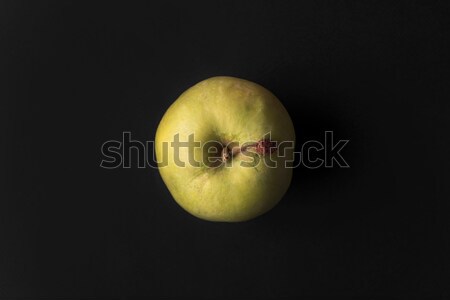 Close up of a green fresh apple isolated over black Stock photo © deandrobot
