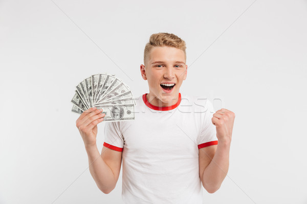 Porträt lächelnd Teenager halten Geld Banknoten Stock foto © deandrobot