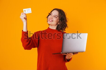 Cheerful young asian man holding flag of Romania isolated on white background Stock photo © deandrobot