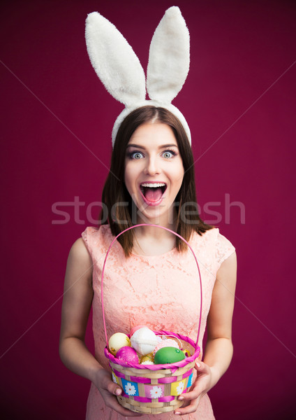 Kadın easter egg sepet mutlu genç kadın tavşan Stok fotoğraf © deandrobot