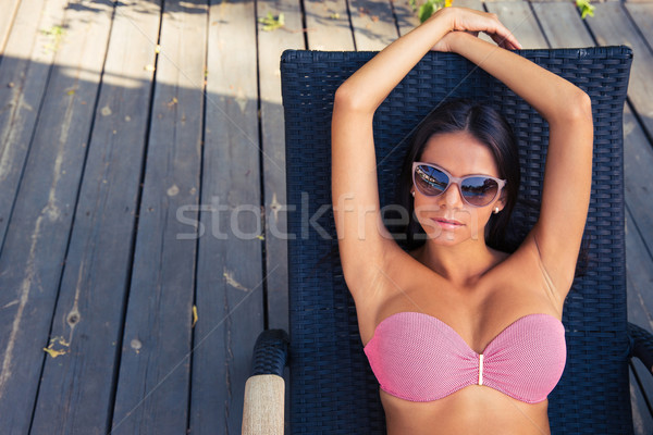 女性 サングラス 日光浴 デッキチェア 屋外 少女 ストックフォト © deandrobot