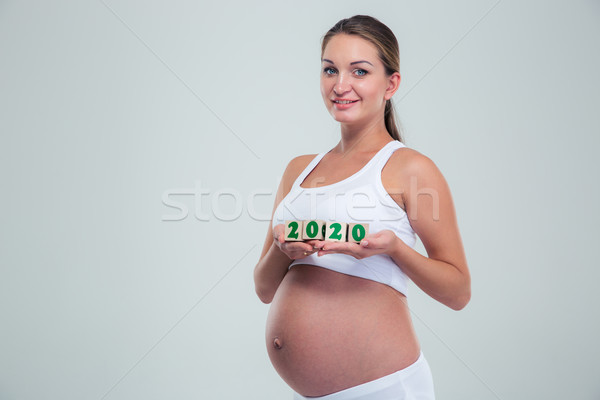 Zwangere vrouw aantal bakstenen portret gelukkig Stockfoto © deandrobot