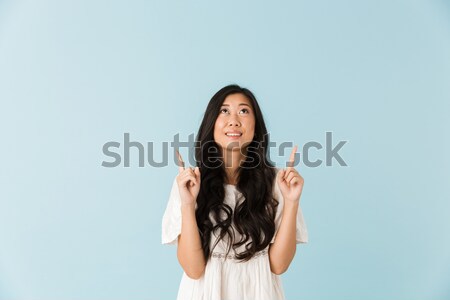 Portrait of a pretty woman shrugging shoulders Stock photo © deandrobot