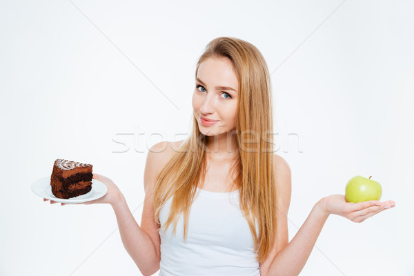 Attractive woman holding healthy and unhealthy food Stock photo © deandrobot