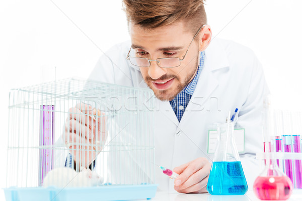 Scientist doing experiments with rat  Stock photo © deandrobot