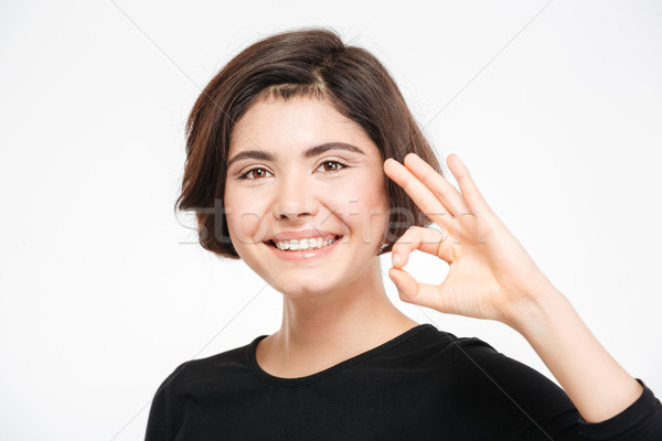 Foto stock: Mujer · sonriente · signo · aislado · blanco