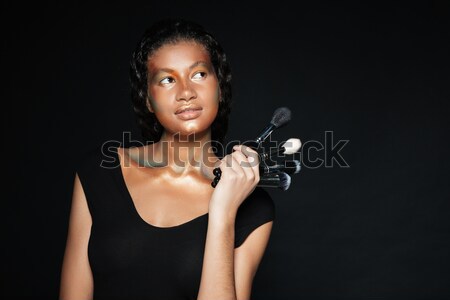 Smiling pretty african american young woman with shining makeup Stock photo © deandrobot