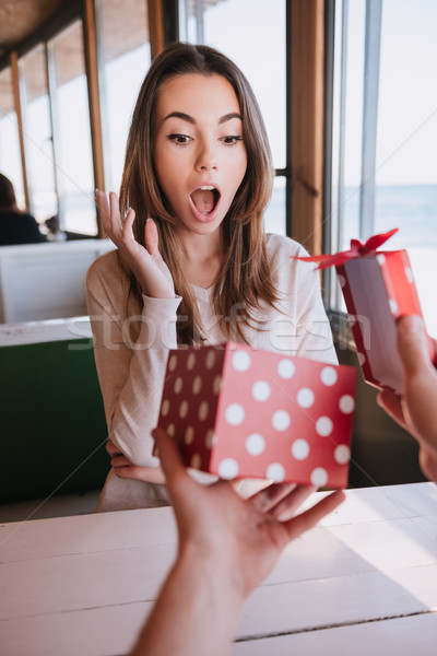 Vertical image of surprised woman gets the gift Stock photo © deandrobot