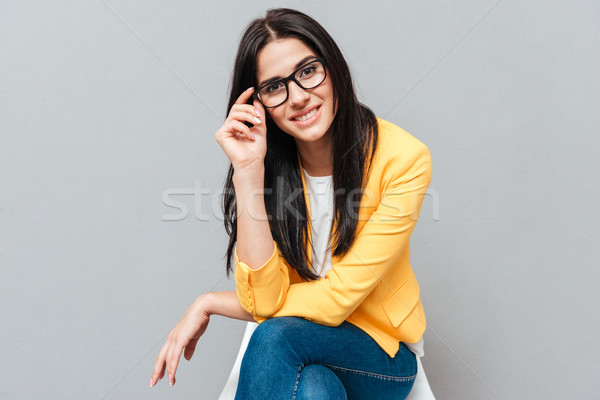 女性 座って スツール グレー 触れる 眼鏡 ストックフォト © deandrobot