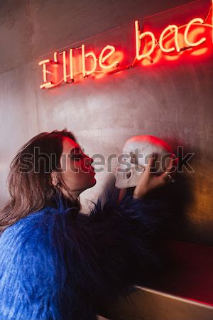 Uwodzicielski młoda kobieta czaszki palenia papierosów Zdjęcia stock © deandrobot