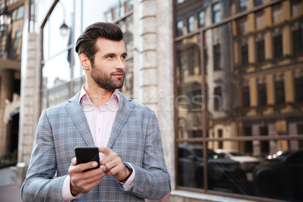 Stok fotoğraf: Yakışıklı · adam · ceket · ayakta · cep · telefonu · portre