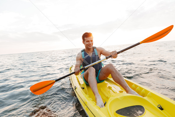 Knappe man kajakken meer zee boot afbeelding Stockfoto © deandrobot