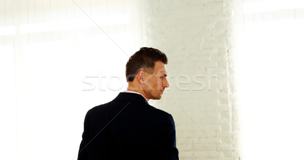 Back view portrait of a businessman  Stock photo © deandrobot