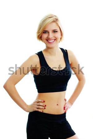 Young smiling fit woman in black sports bra Stock photo © deandrobot