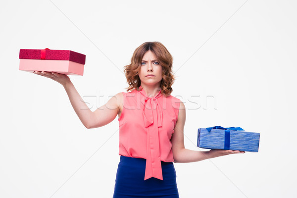 Young woman making choice between gifts Stock photo © deandrobot