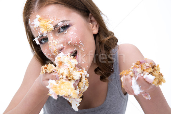 Fiatal aranyos nő eszik torta fehér Stock fotó © deandrobot
