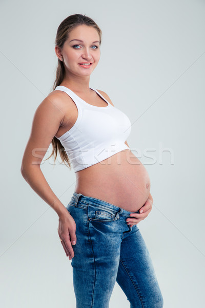 Portrait of a smiling pregnant woman Stock photo © deandrobot