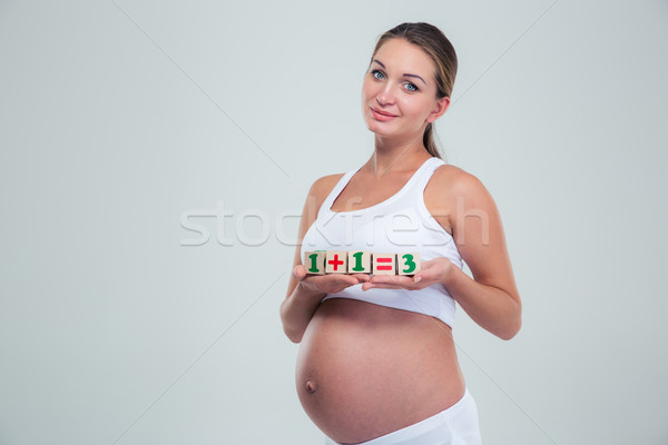 беременная женщина кирпича уравнение изолированный белый Сток-фото © deandrobot