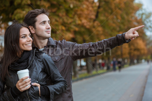 Couple walking in autumn park Stock photo © deandrobot