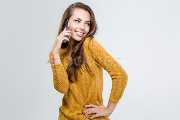 Happy cute woman talking on the phone Stock photo © deandrobot