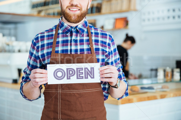 [[stock_photo]]: Souriant · barbu · garçon · brun · tablier