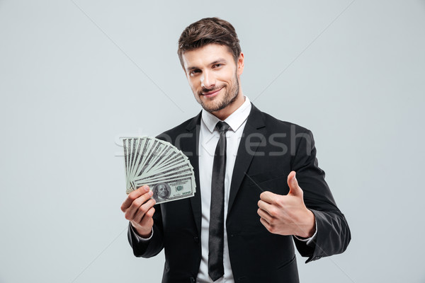 Foto stock: Sorridente · jovem · empresário · dinheiro