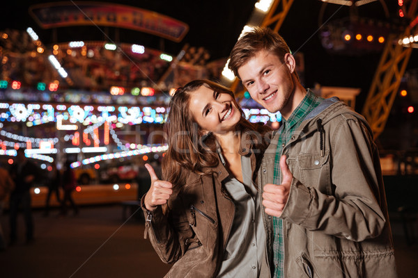 Close up of couple in amusement park Stock photo © deandrobot