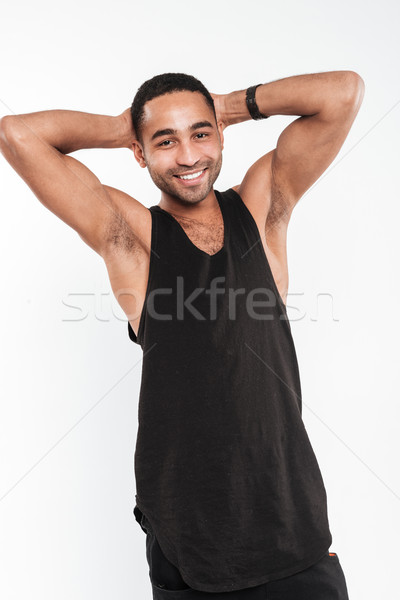 Cheerful young dark skinned man Stock photo © deandrobot