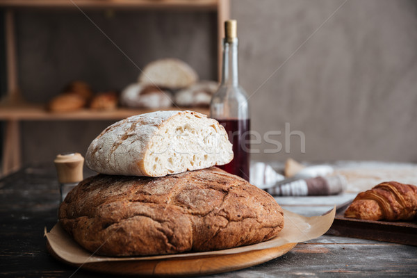 Cropped image of a lot of bread on table Stock photo © deandrobot