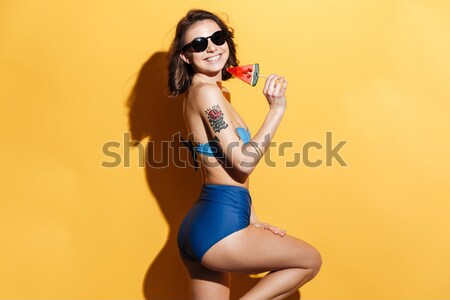 [[stock_photo]]: Jeune · fille · maillot · de · bain · banane · regarder · caméra