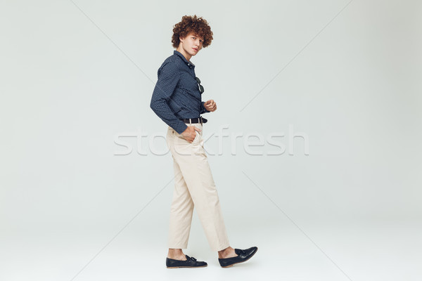 Concentrated young retro man dressed in shirt Stock photo © deandrobot