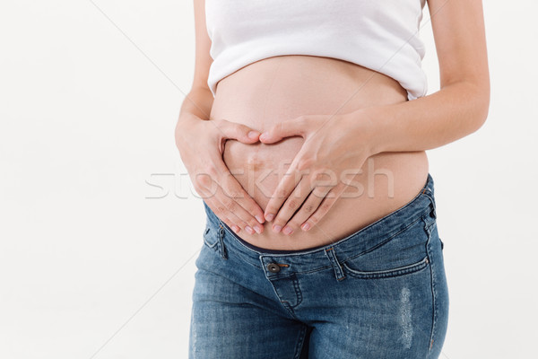 Foto stock: Imagem · mulher · grávida · de · mãos · dadas · barriga · coração · gesto