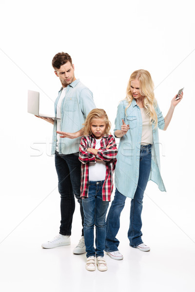 Full length portrait of a busy family having and argument Stock photo © deandrobot