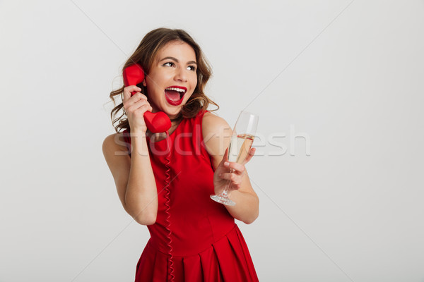 Full length portrait of a happy young woman Stock photo © deandrobot