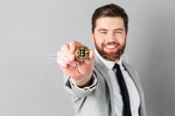 Close up portrait of a smiling businessman Stock photo © deandrobot
