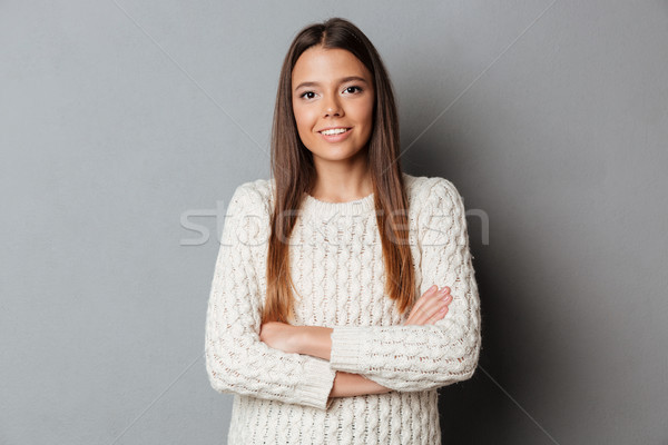 Portrait of a young smiling girl in sweater Stock photo © deandrobot