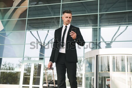 Handsome businessman dressed in suit Stock photo © deandrobot