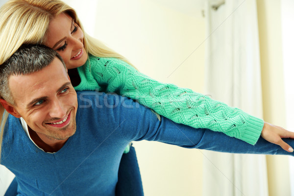 Two young happy person with the hands lifted upwards Stock photo © deandrobot