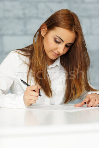 молодые счастливым деловая женщина подписания документа женщину Сток-фото © deandrobot