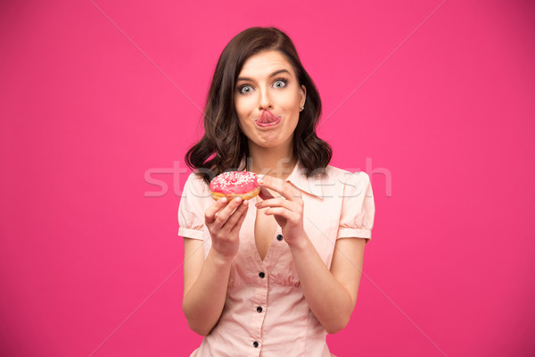 Foto stock: Mulher · jovem · rosquinha · língua · rosa