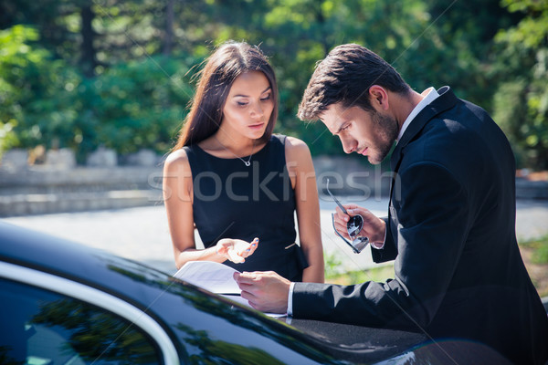 Businesspeople reading documents Stock photo © deandrobot