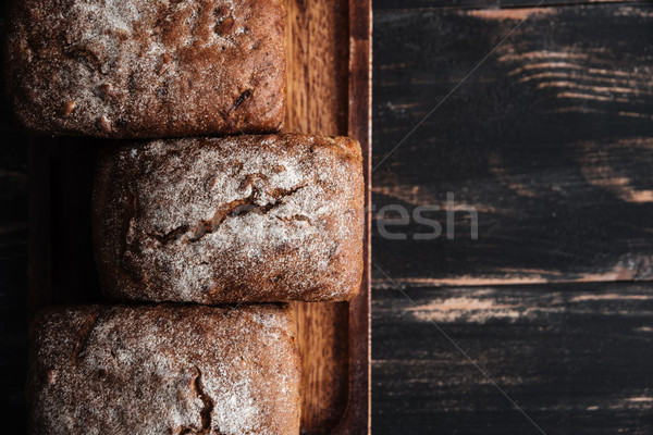 Stock photo: Bread with flour on dark wooden table