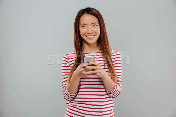 年輕 亞洲的 女子 電話 商業照片 © deandrobot