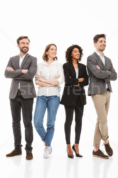 Full length portrait of a group of multiracial business people Stock photo © deandrobot