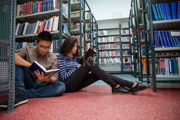 Students Sitting On The Floor And Reading Books Stock Photo C Dean