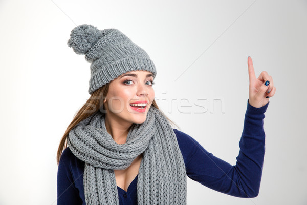 Gülümseyen kadın eşarp şapka işaret parmak Stok fotoğraf © deandrobot