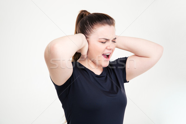 Fat woman in sportswear covering her ears and shouting Stock photo © deandrobot