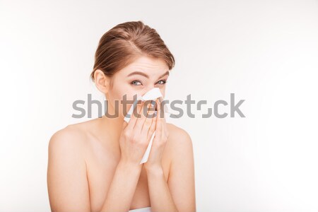 Pretty woman blowing nose and using paper handkerchief  Stock photo © deandrobot